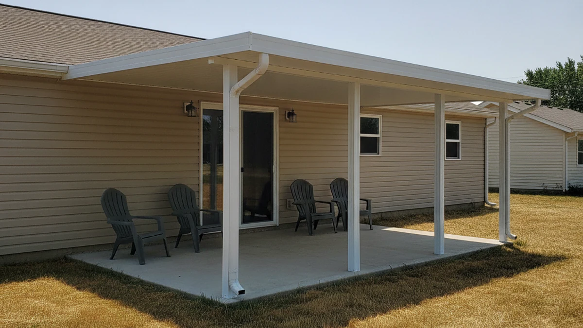 Finished attached patio cover installation on modest Manhattan Kansas home with shaded concrete patio